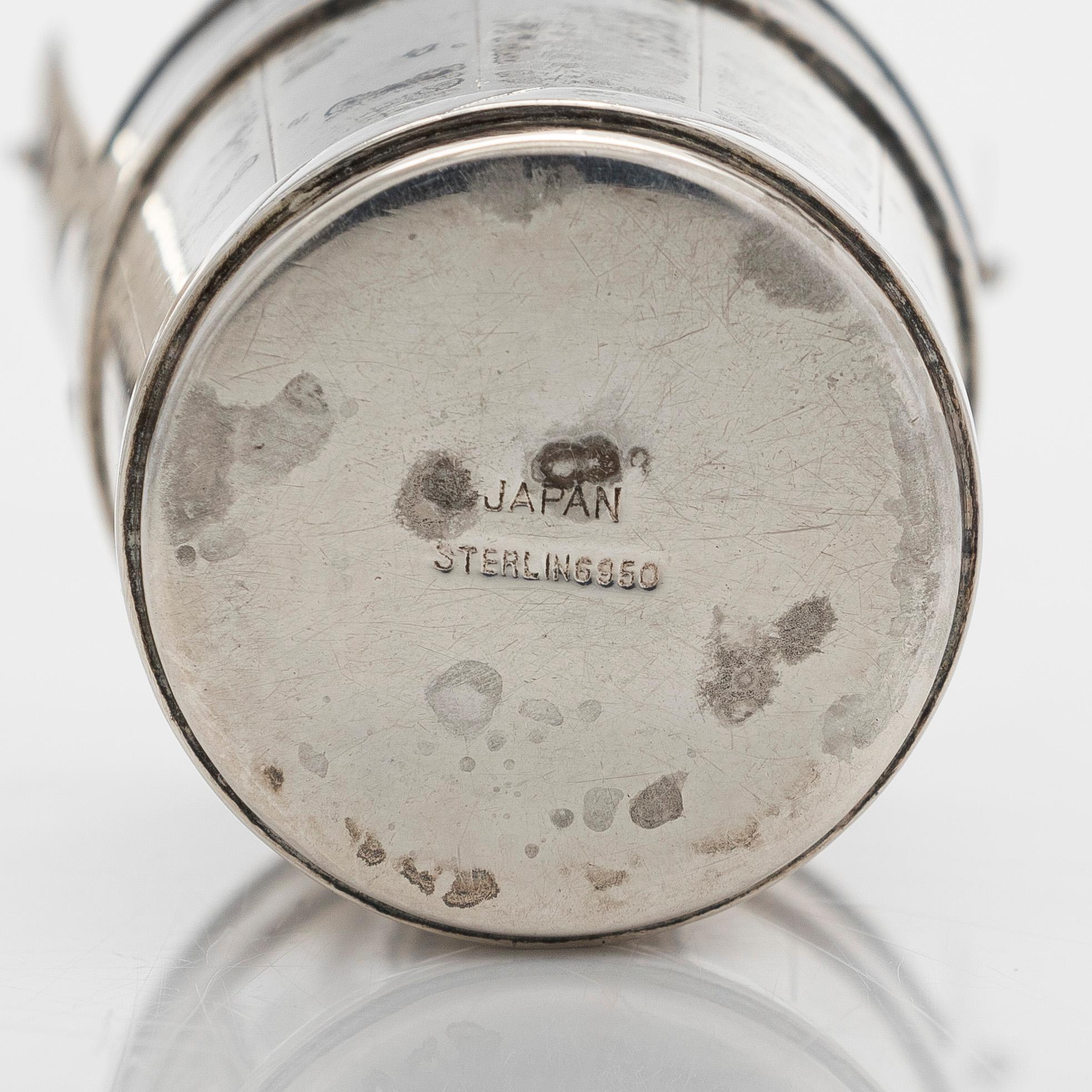 A pair of sterling silver salt- and pepper shakers , Japan, latter half of the 20th century.