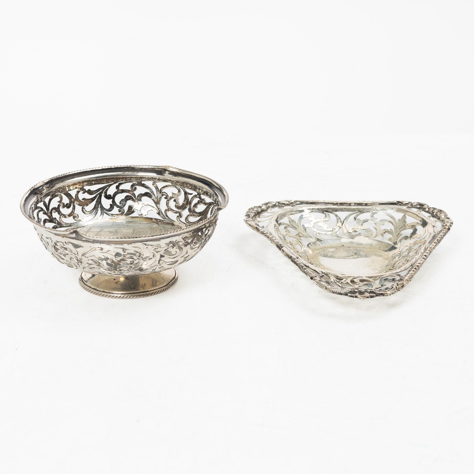 Two pierced silver bowls and two sugar spoons, including Sweden and Endland, 20th century.