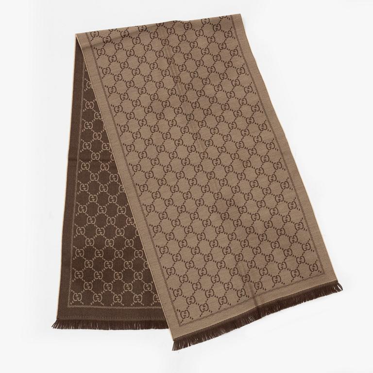 Gucci, a wool 'GG Jaquard Knitted Scarf'.