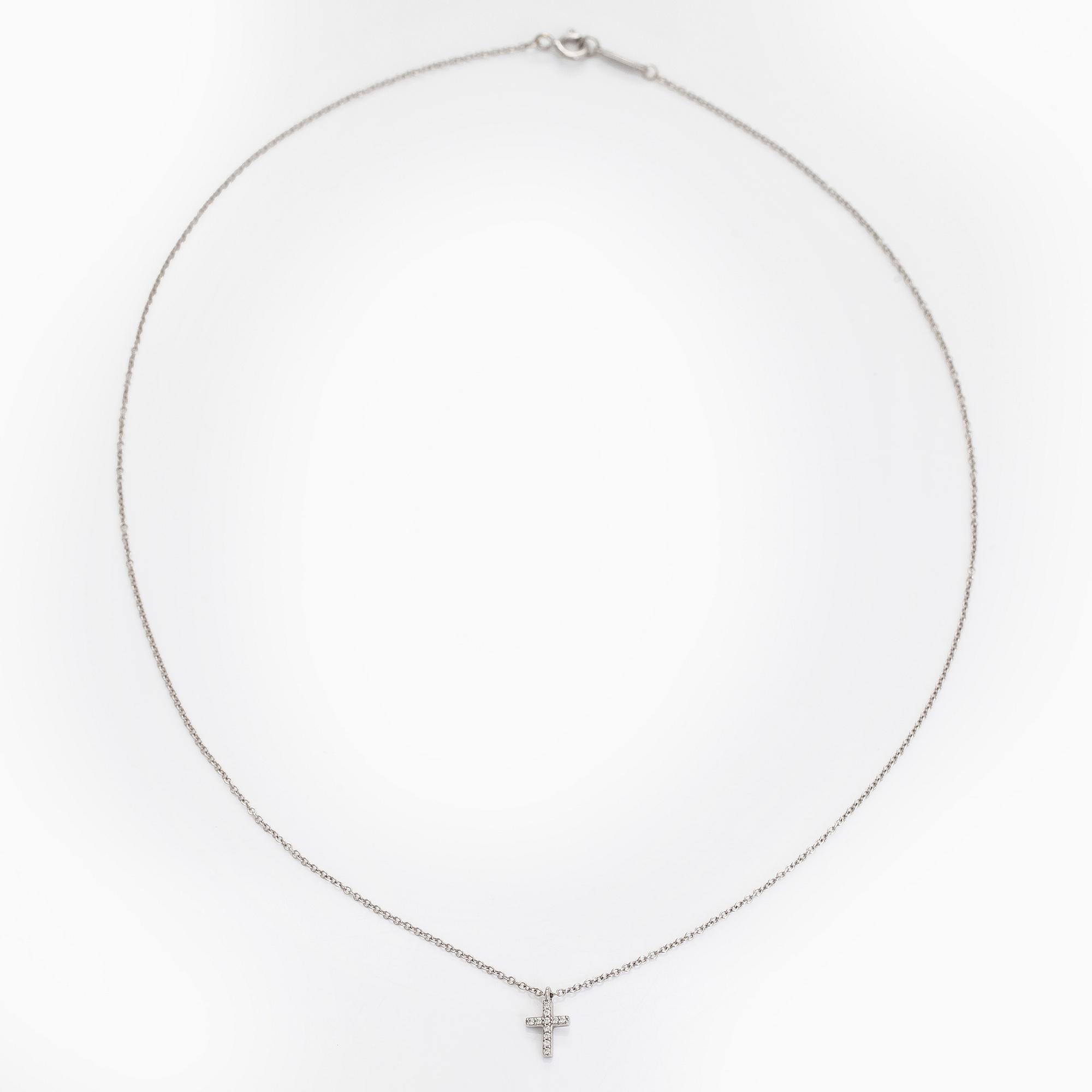 Tiffany & Co, an 18K white gold "Metro Cross" necklace with diamonds.