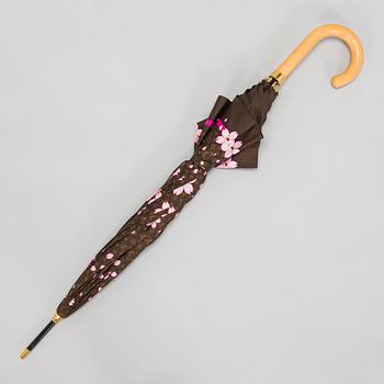 Louis Vuitton x Takashi Murakami, a 'Monogram Cherry Blossom' umbrella.