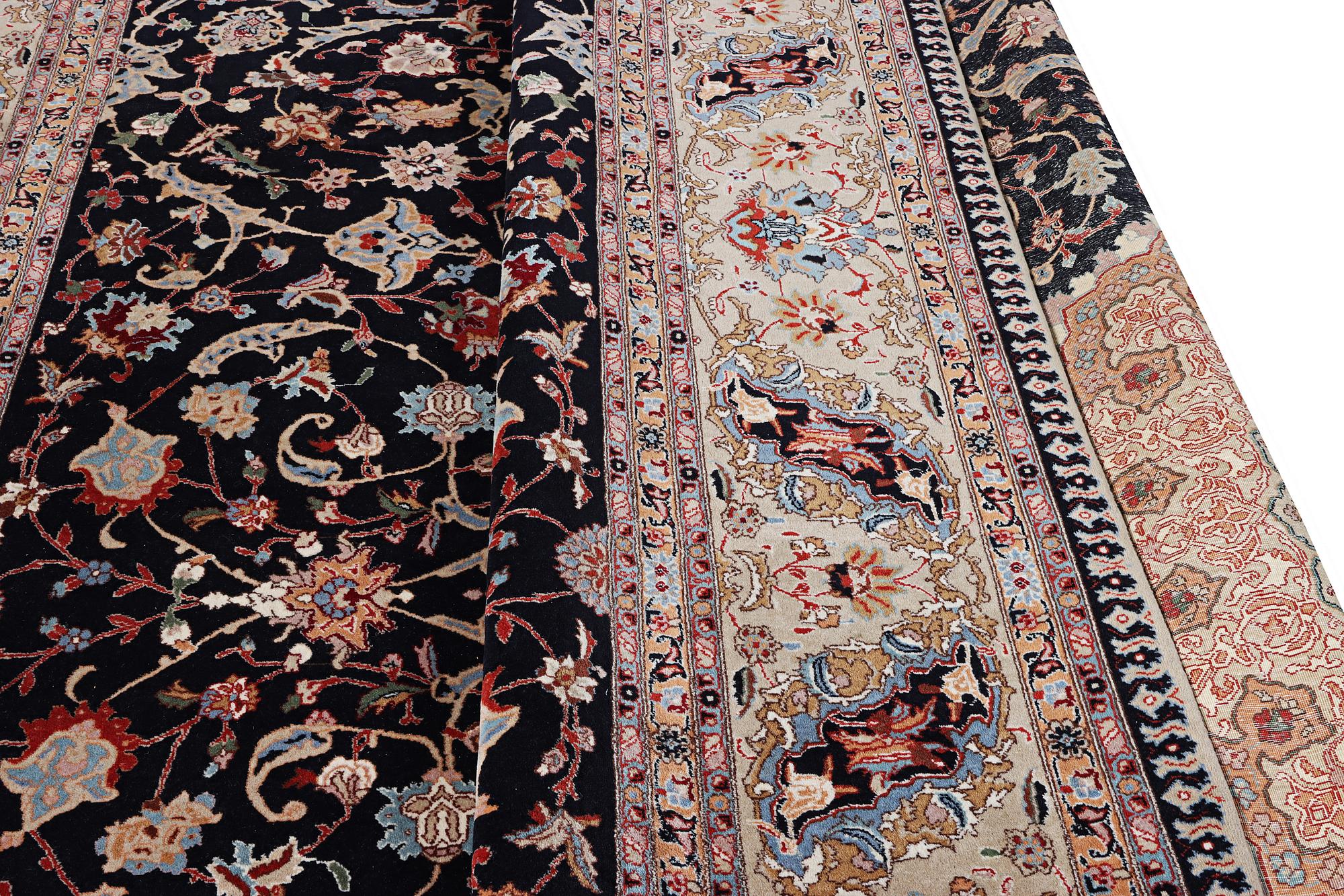 A semi.antique Tabriz carpet, 50 raj, c. 390 x 290 cm.