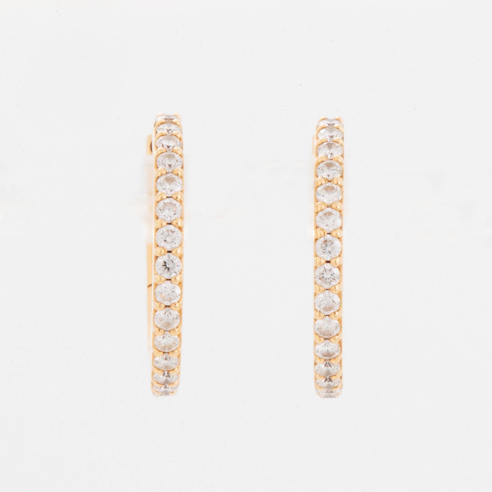 A pair of Ole Lynggaard earrings "Love" in 18K gold set with round brilliant-cut diamonds.