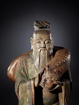 A large wooden scultpure of a daoist dignitary, 17/18th Century.