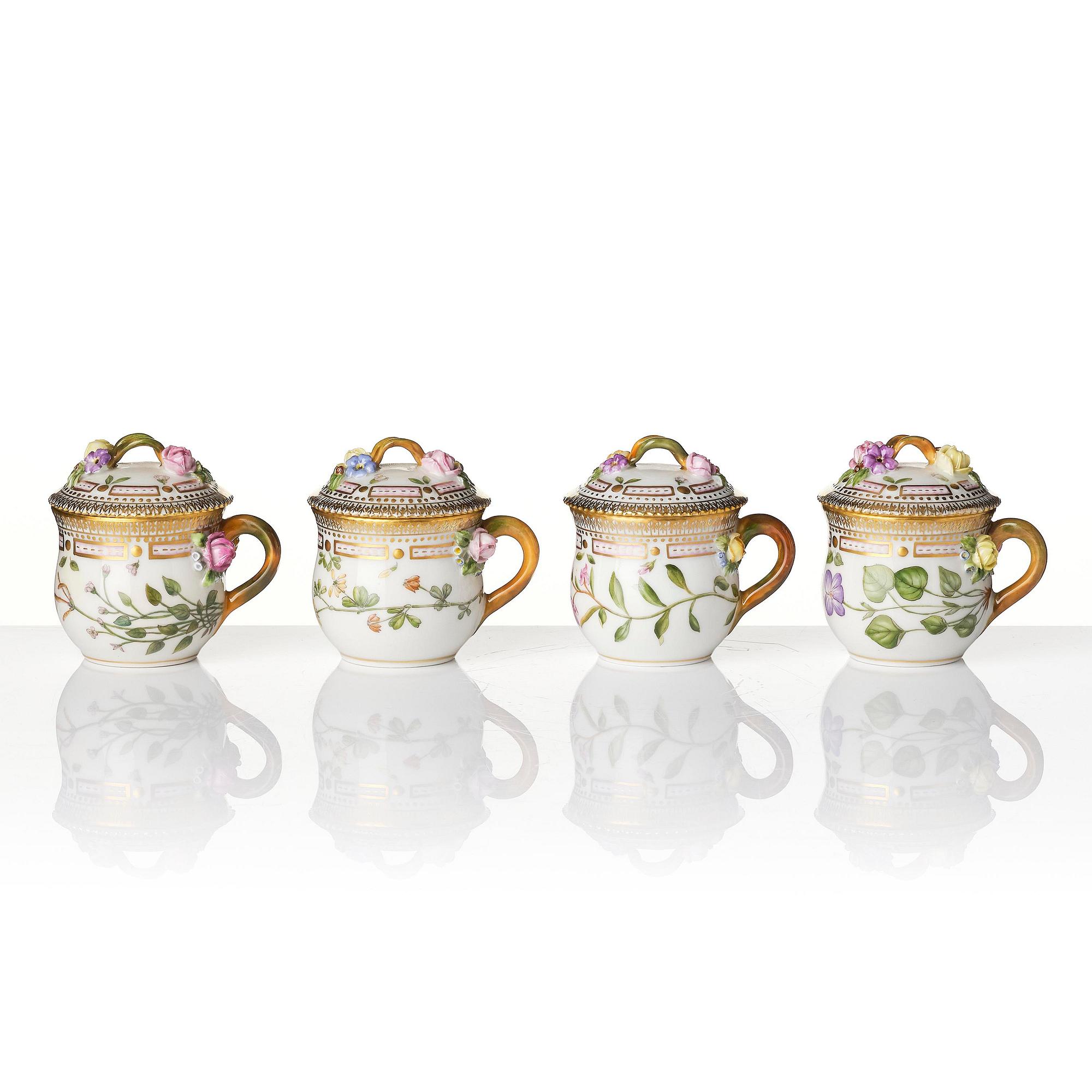 A set with four Royal Copenhagen 'Flora Danica' custard cups with covers and stands, Denmark, 20th century.