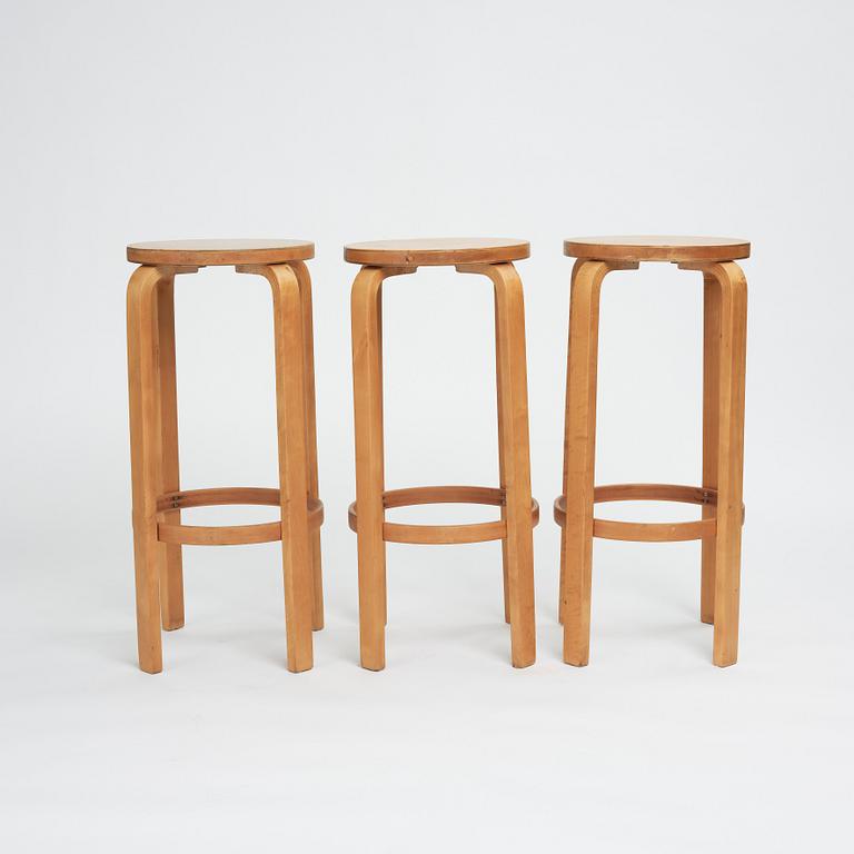 Alvar Aalto, a set of three bar stools, model "64", Finmar Ltd, Finland 1930s.