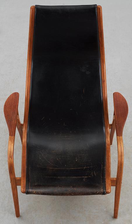 An Yngve Ekström teak and black leather easy chair 'Lamino', Swedese.
