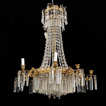 An Oscarian gilt brass eight-light chandelier.