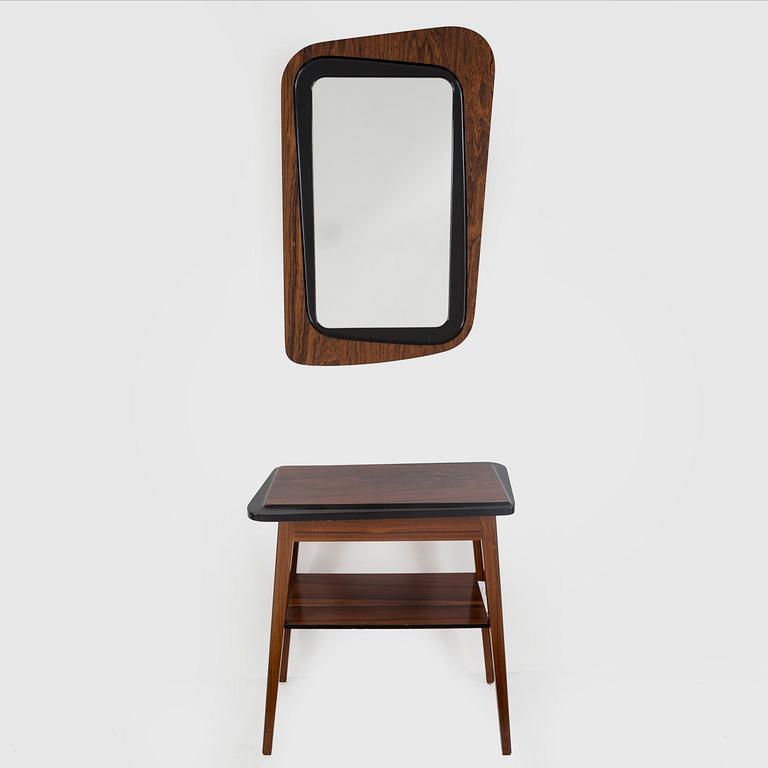 A second half of the 20th century rosewood mirror with table.