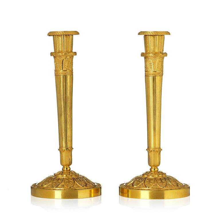 A pair of Empire ormolu candlesticks.