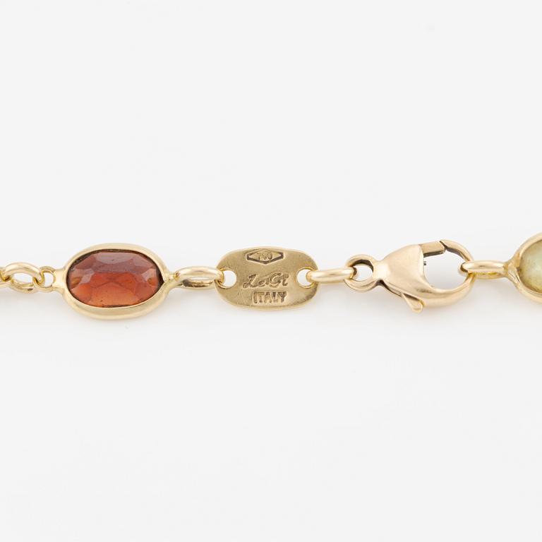 Necklace/bracelet in 18K gold with various coloured gemstones including topaz, citrine, amethyst, garnets, and peridot.