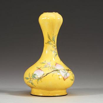 A yellow enamel on copper vase, Qing dynasty (1644-1912), with Qianlong four character mark.