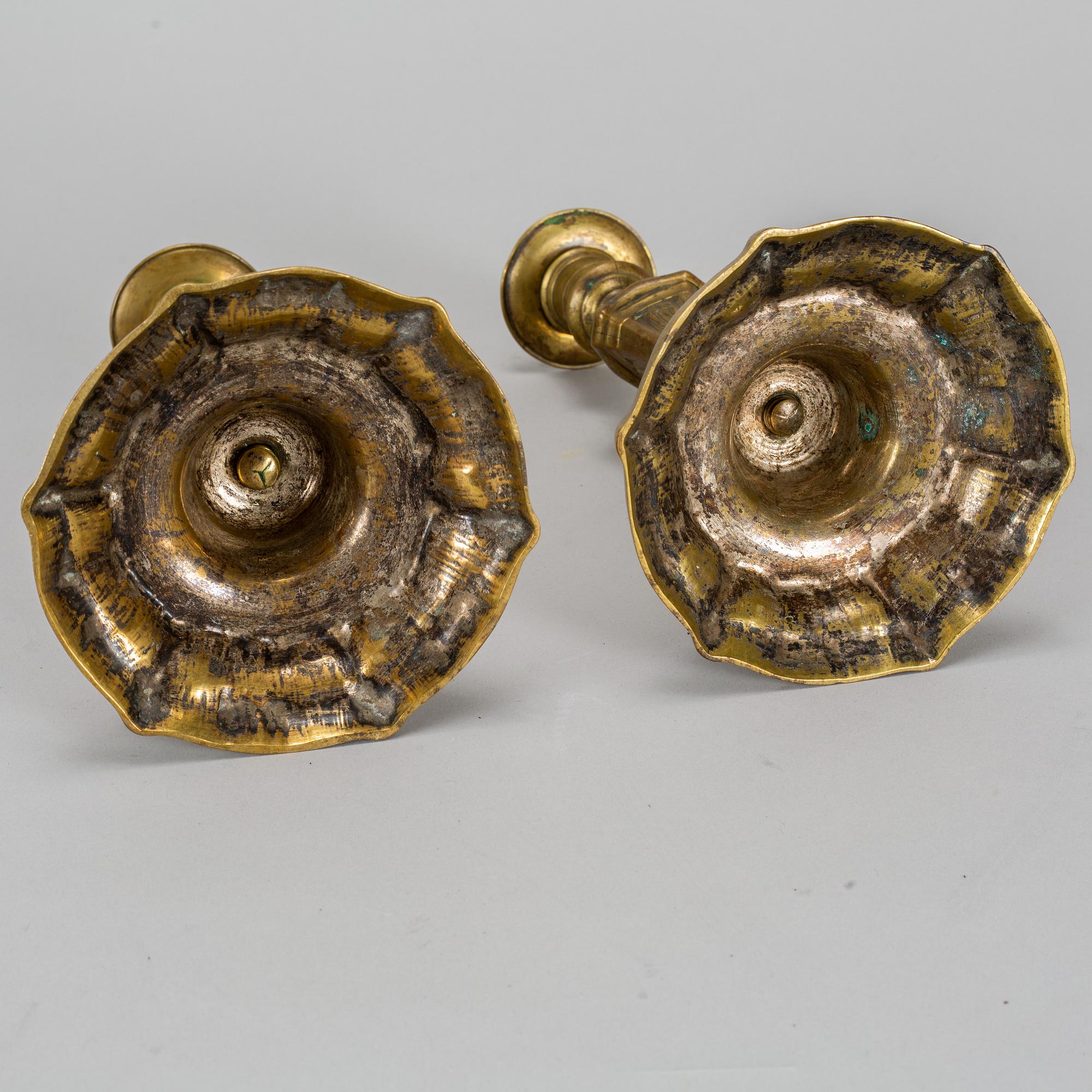 A pair of 18th century bronze candlesticks.