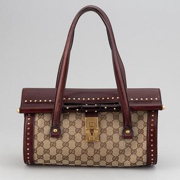 Gucci, a monogram canvas bag.