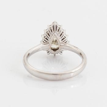 An 18K white gold ring set with  a pear brilliant-cut diamond.