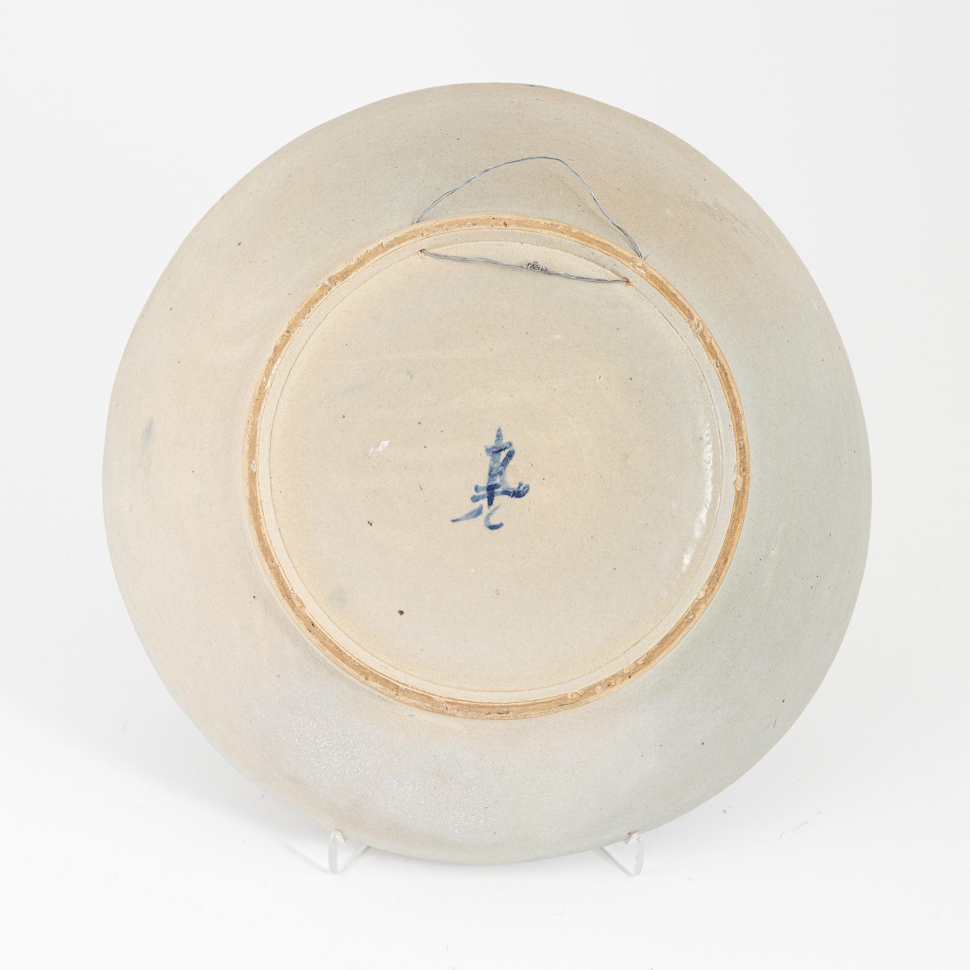 A ceramic dragon dish, Sout East Asia, 20th century.
