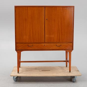 A mahogany veneered cabinet, 1940s/50s.