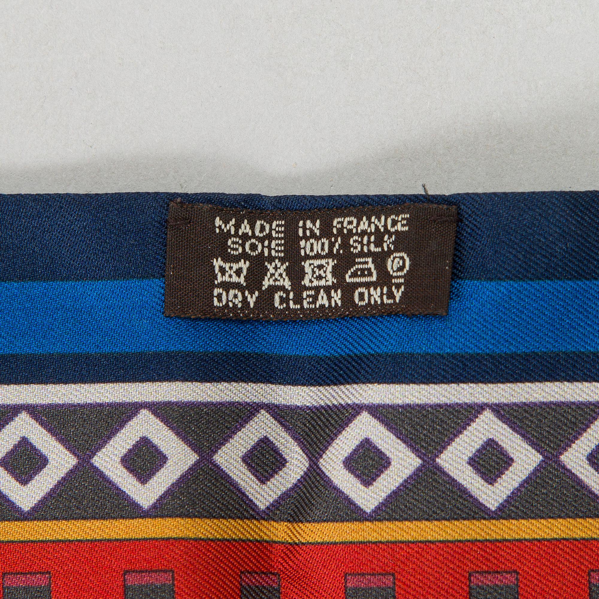 Hermès, a 'Collier de Chiens Maxi Twilly' silk scarf.