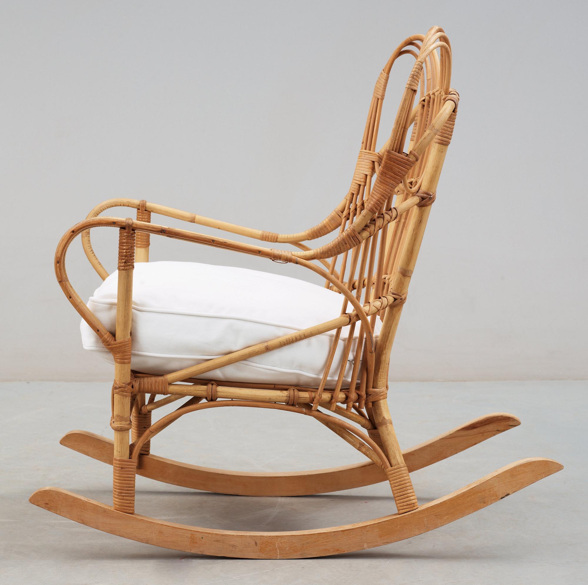 A Josef Frank ratten and beech rocking chair, Svenskt Tenn, model 1077, 1940's-50's.
