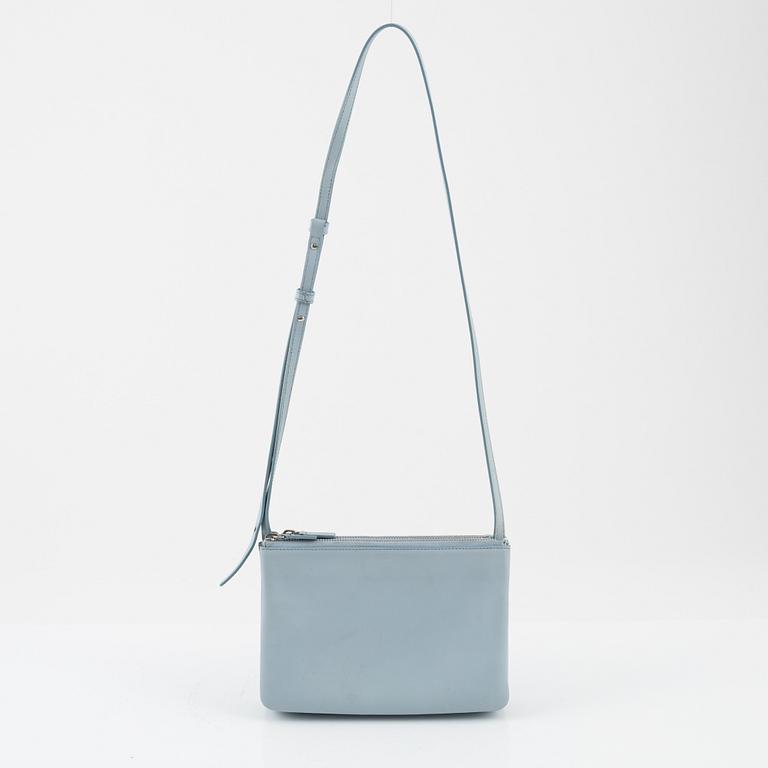 Céline, a baby blue leather 'Trio bag'.