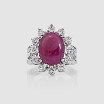 1439. A 10.00 ct untreated cabochon-cut ruby and brilliant-cut diamond ring. Total carat weight of diamonds 0.70 ct. GRS cert.