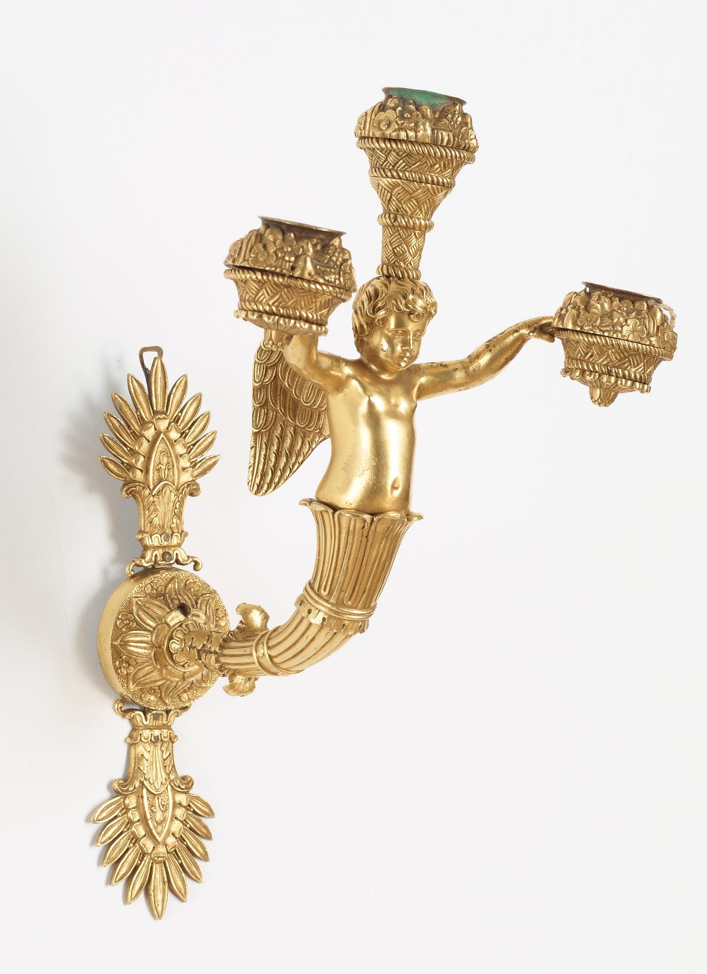 A pair of Empire early 19th century three-light wall-lights.