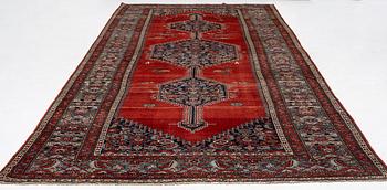 A Malayer runner, west Persia, c. 560 x 200 cm.