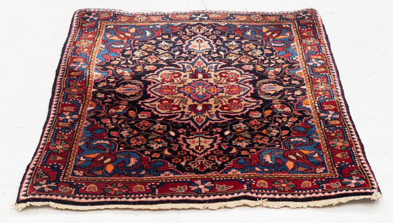 A Sarouk/Jozan rug, c. 86 x 64 cm.