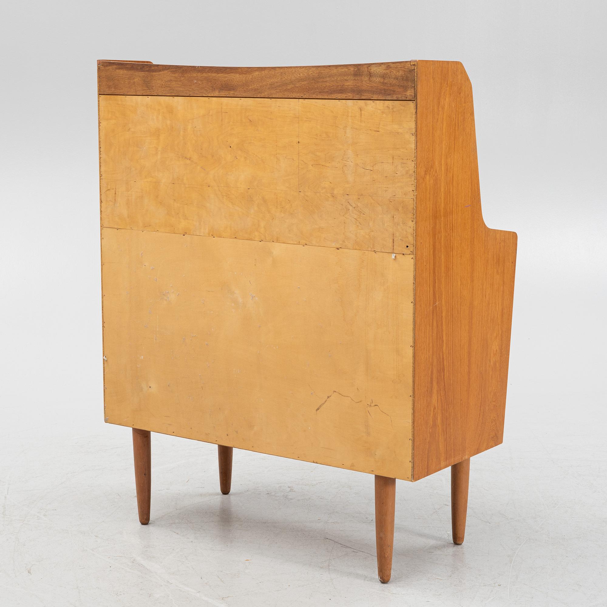 A teak writing desk, 1950-60s.