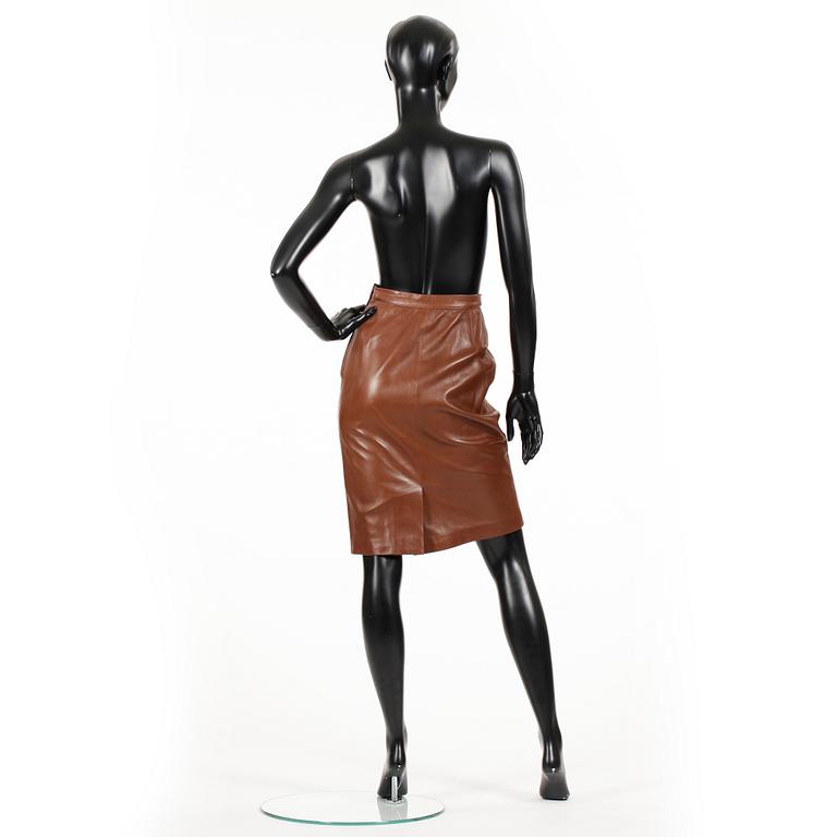 YVES SAINT LAURENT, a brown leather skirt.