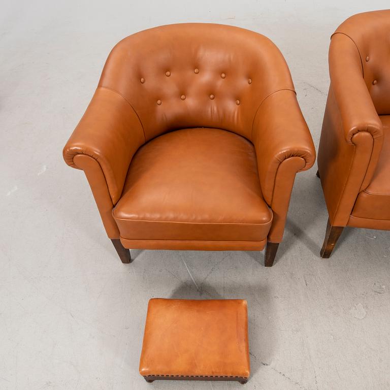 A leather sofa and armchair 1940s.