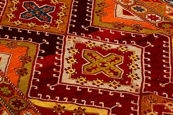 An antique/semi-antique Anatolian rug, around 260 x 127 cm.