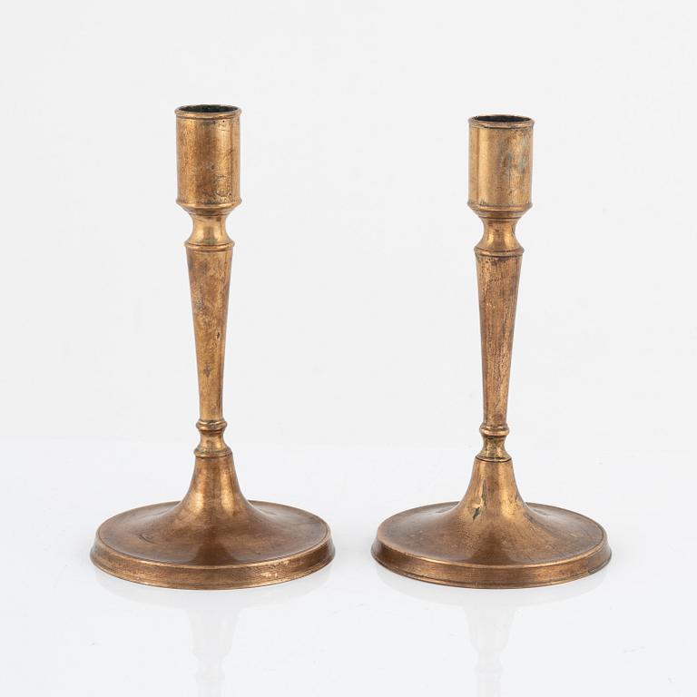 A pair of bronze candlesticks, 18th Century.