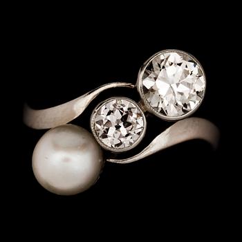 An old cut diamond and possibly natural blister pearl ring. Diamonds total carat weight circa 0.90ct.