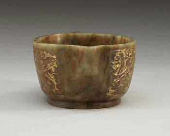 An archaistic carved and gilded vessel, Qing dynasty.