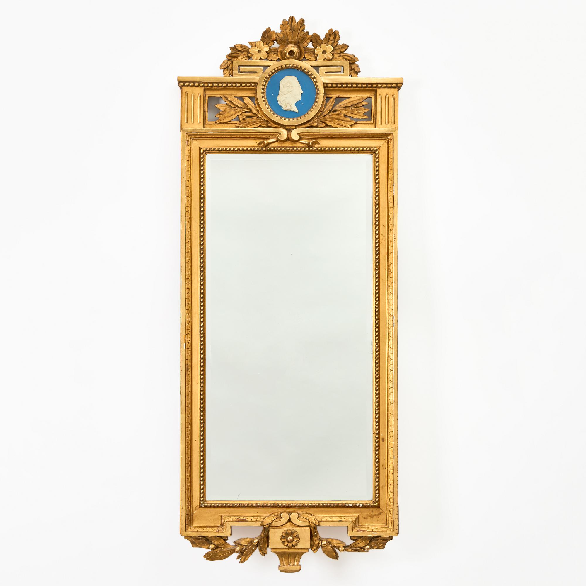 A Gustavian giltwoos mirror by J. Åkerblad (master in Stockholm 1758-99).