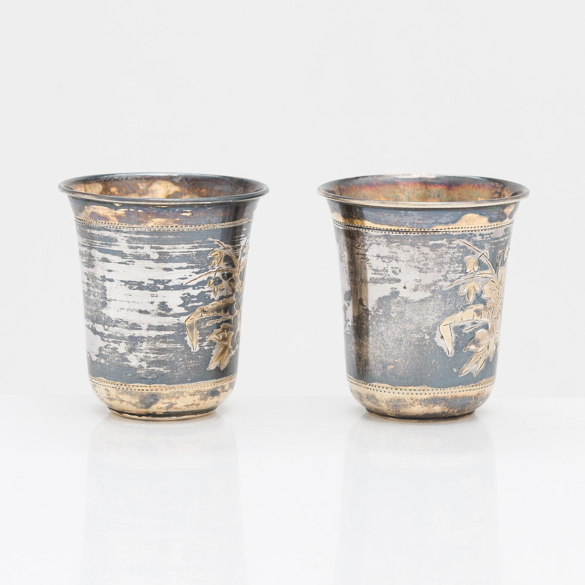 Four parcel-gilt silver beakers, Moscow 1870, 1876 and 1890.