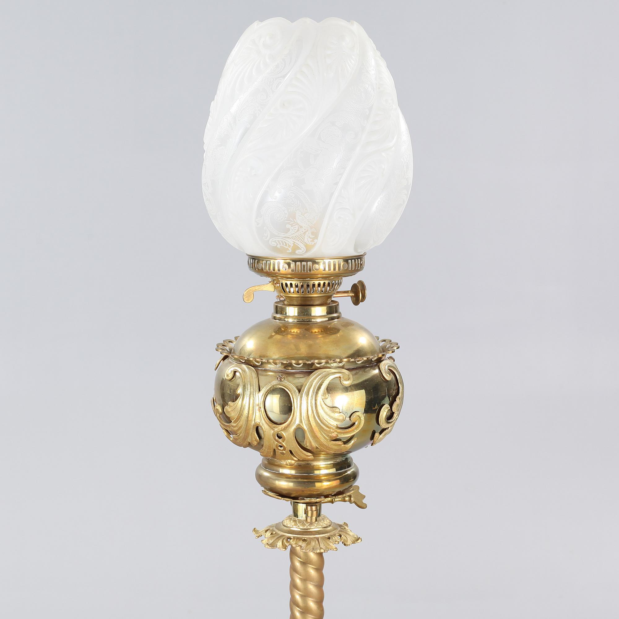 Two floor parafine lamps, 20th century.