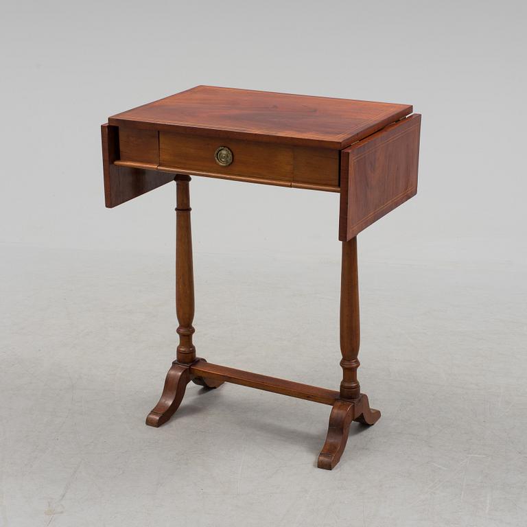 A Swedish first half of the century Karl Johan style mahogany veneered table.