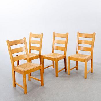 A set of four wicker and oak 1970s chairs.