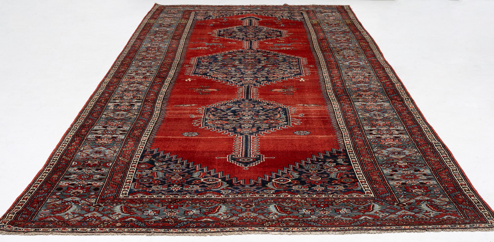 A Malayer runner, west Persia, c. 560 x 200 cm.