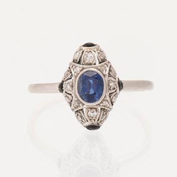 Art Deco platinum ring with an oval faceted sapphire and old-cut and rose-cut diamonds.