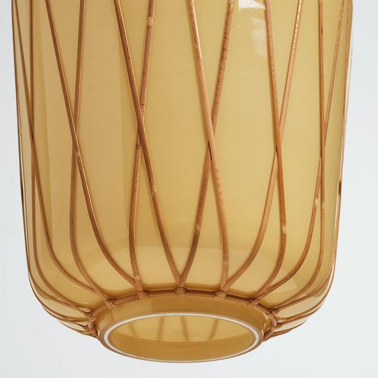 A pair of Swedish Modern vanilla coloured glass ceiling lights with fretted rattan, 1930-40's.