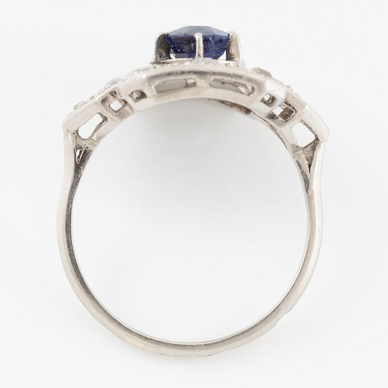 Platinum ring with sapphire and old-cut diamonds.