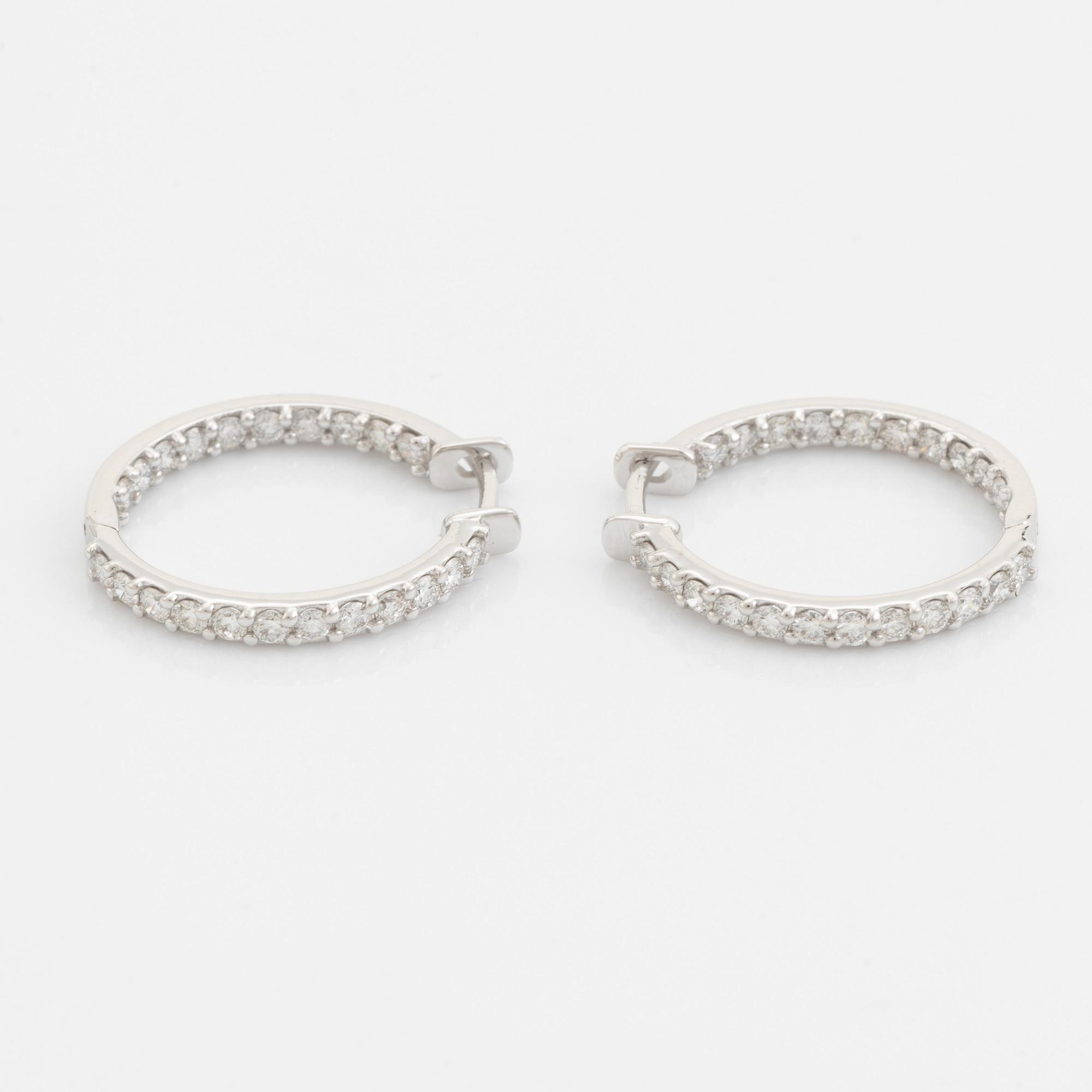 Brilliant cut diamond hoop earrings.