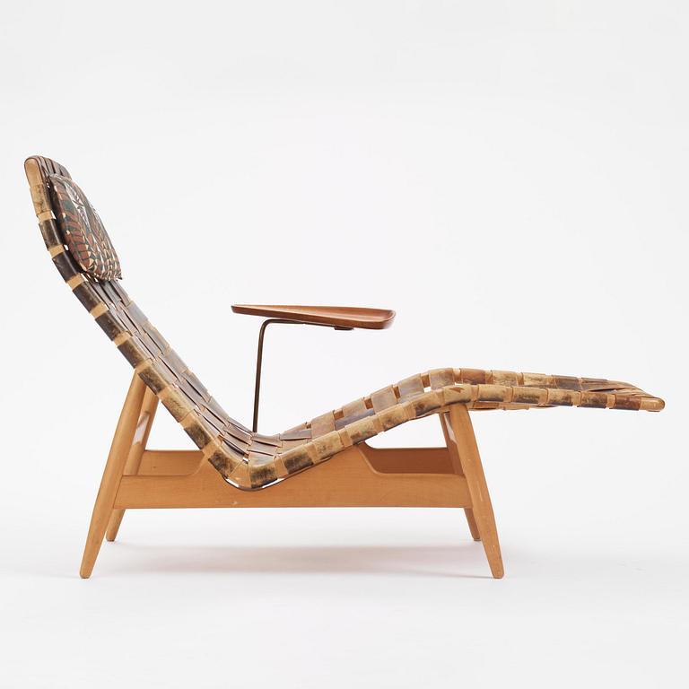 Arne Vodder, a woven leather lounge chair with attached side table, Bovirke, Denmark, 1950s.