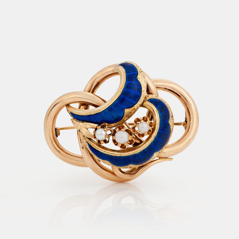 BROSCH/HÄNGE med tre mabépärlor samt blå och röd emalj.