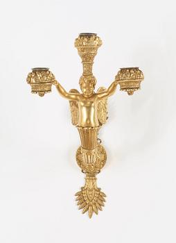 A pair of Empire early 19th century three-light wall-lights.