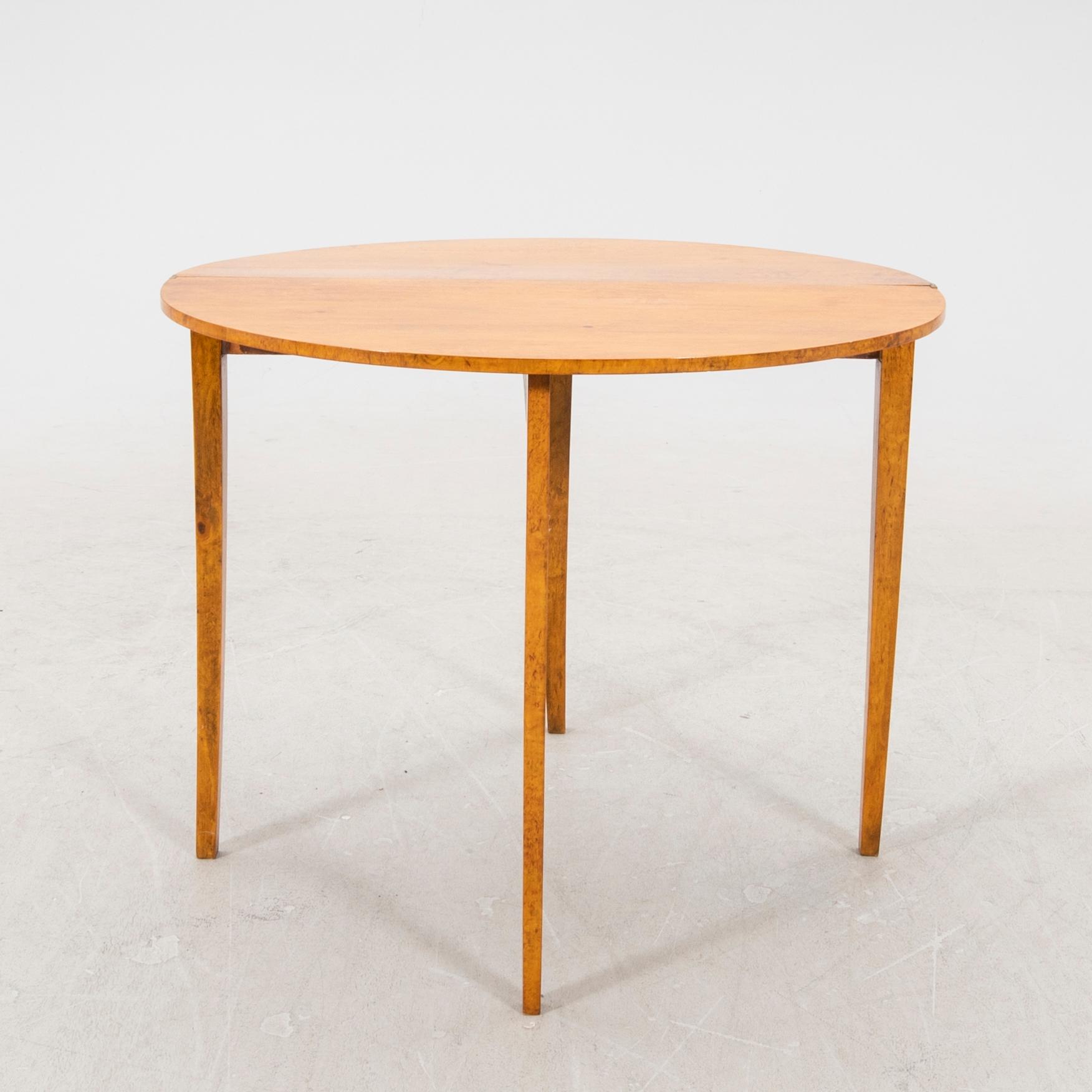 A birch folding table later part of the 19th century.