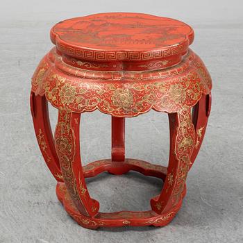 A Chinese red lacquered stool, early 20th century.